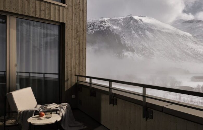 balcony with view on Gemstock mountain covered with snow in Switzerland